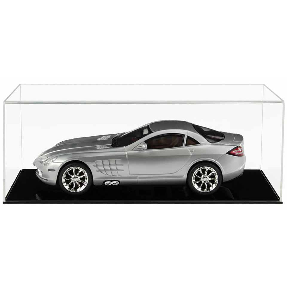 Clear Acrylic Display Cover on a Black plain acrylic base with a white background, There is a grey 1:12 scale model car displayed inside the display case.