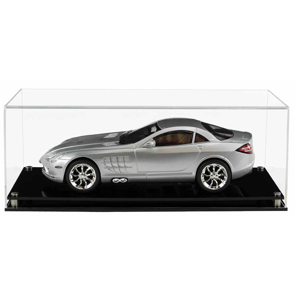 Clear Acrylic Display Cover on a Black Modern Acrylic base with a white background, There is a silver 1:12 scale model car inside the display case.